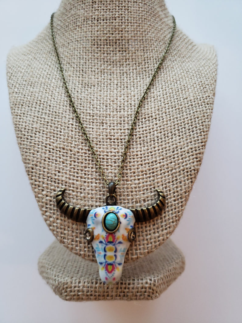 Turquoise and White Colored Buffalo Skull on Brass Necklace